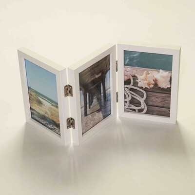 Hinged photo frame for 3 x 6x4 inch photos with white finish.