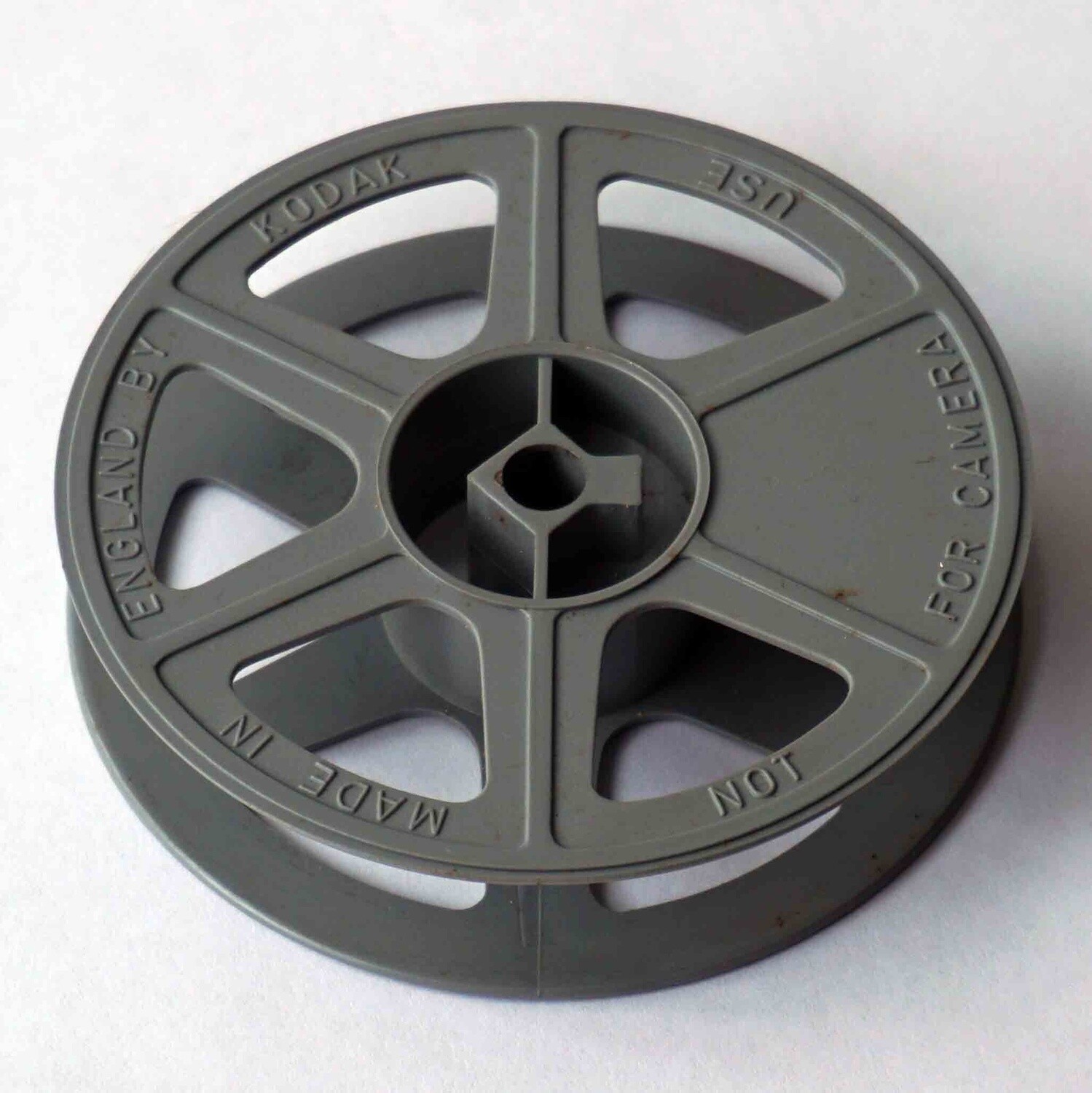 16mm film reel for 100ft of 16mm film, grey colour.