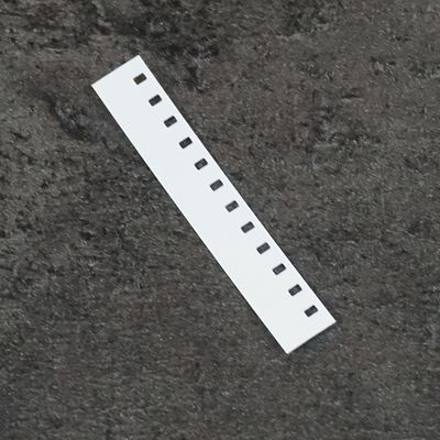 Regular 8mm film leader, white acetate, sold in 5M lengths on film reel.