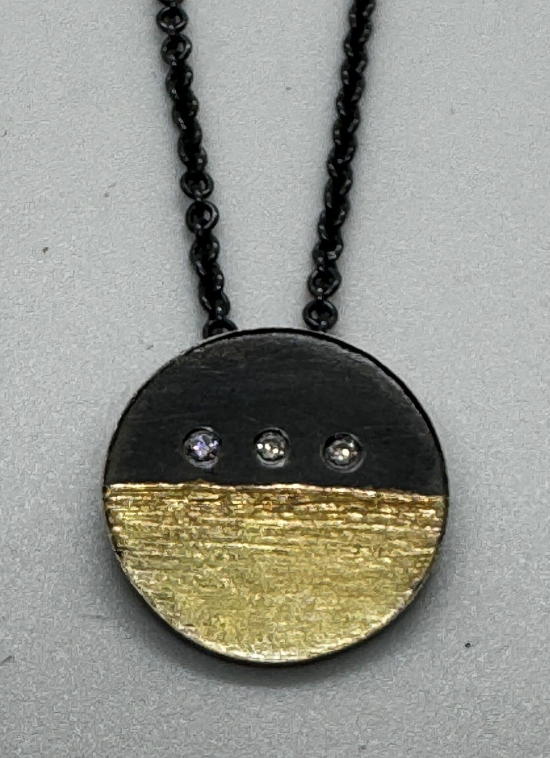 Keleher Necklace Black and Gold Geometric Round Horizontal