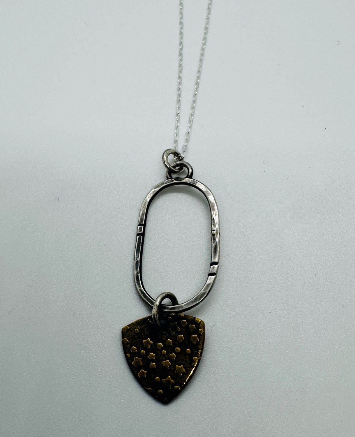 O&#39;Brien Necklace Hammered Oval with Starry Textured Brass Triangle Dangle