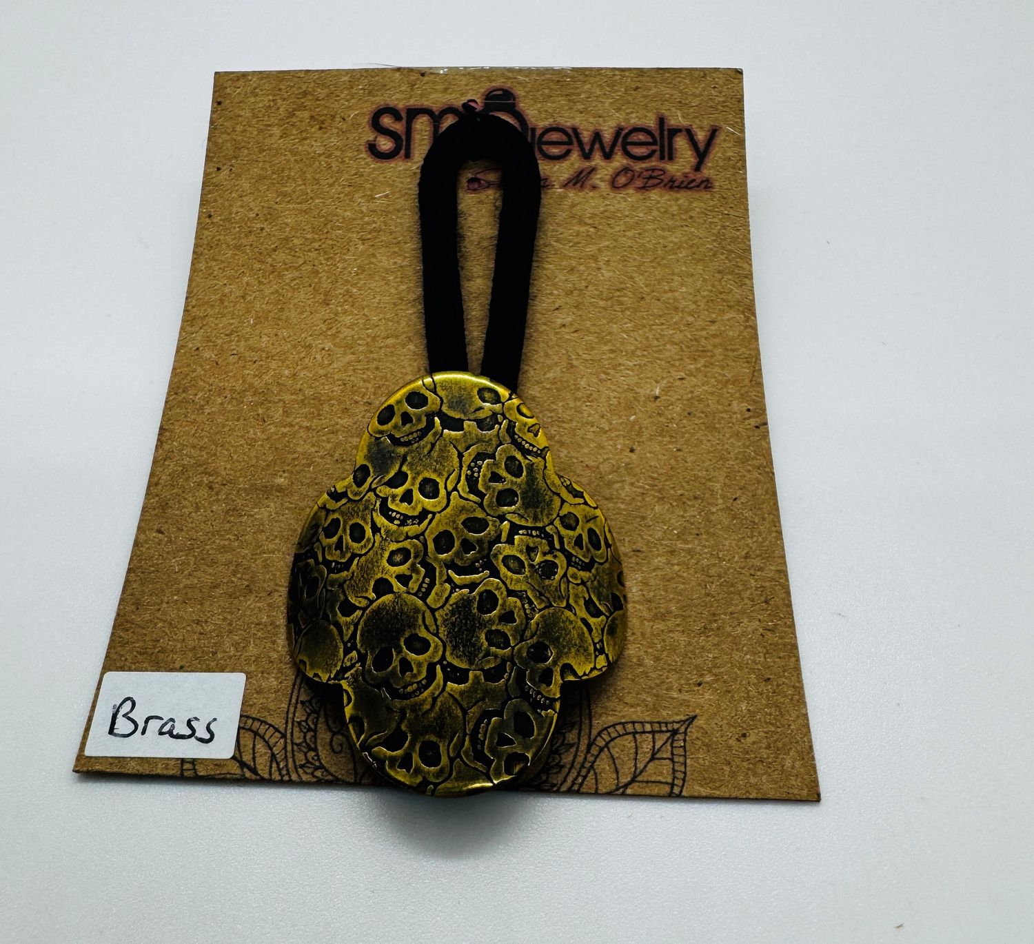 O&#39;Brien Ponytail Holder Brass Skulls Quatrefoil Shape