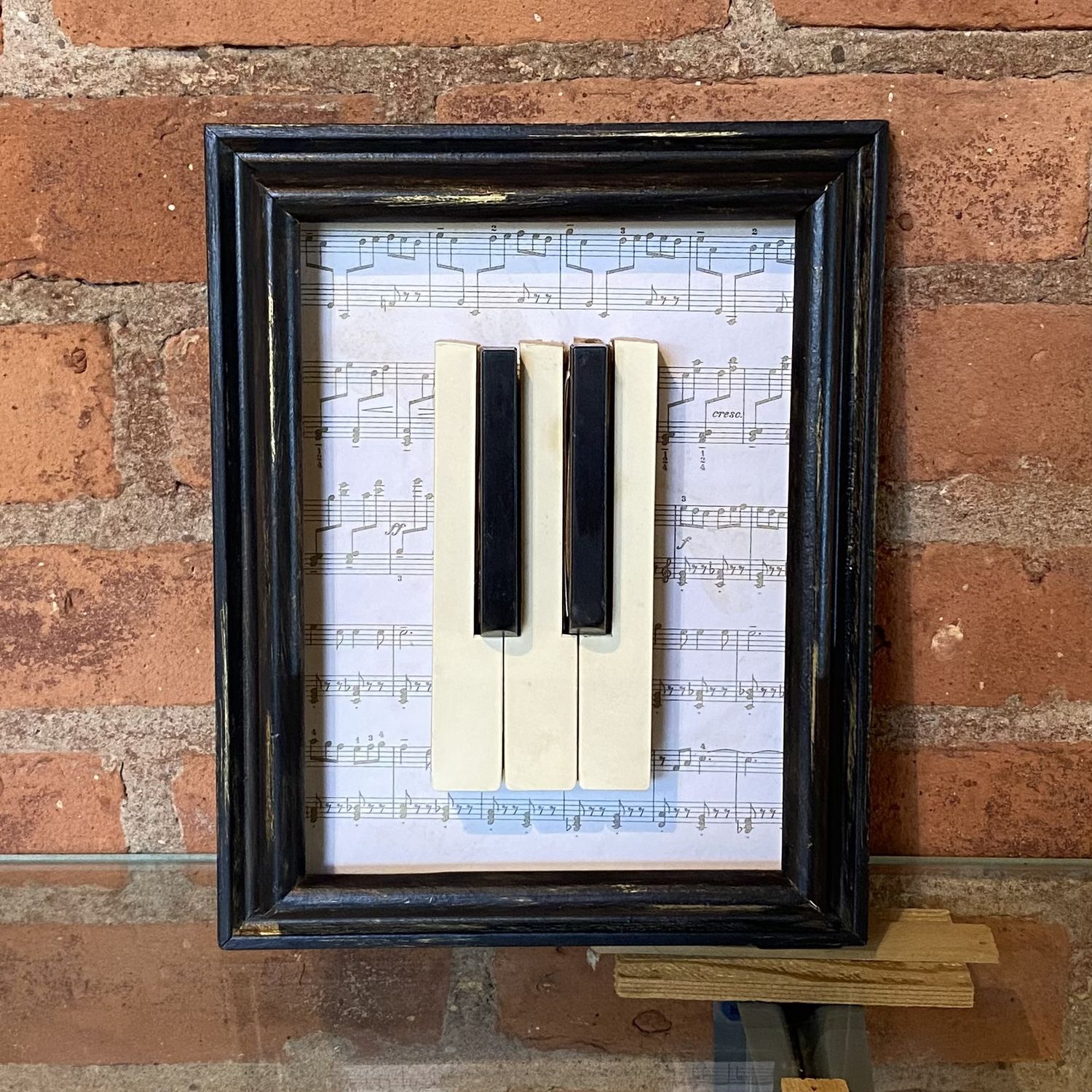 Angerame Black and Gold Frame with Piano Keys