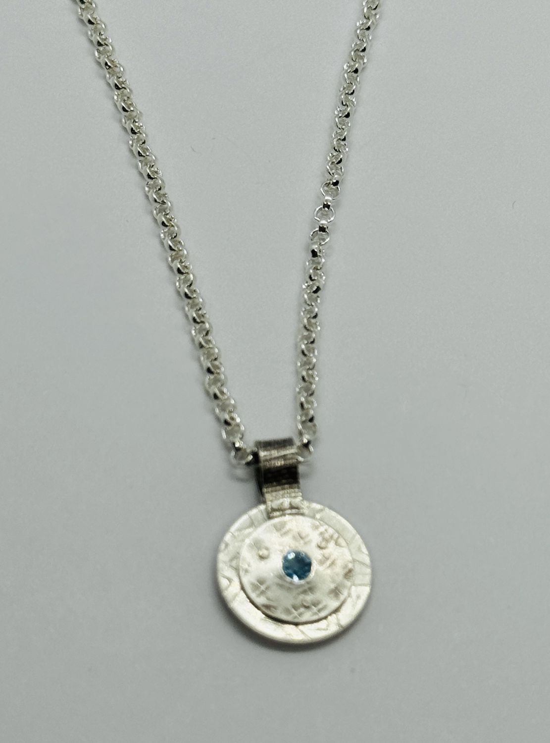 Bent Metal Necklace Blue Topaz In Circle