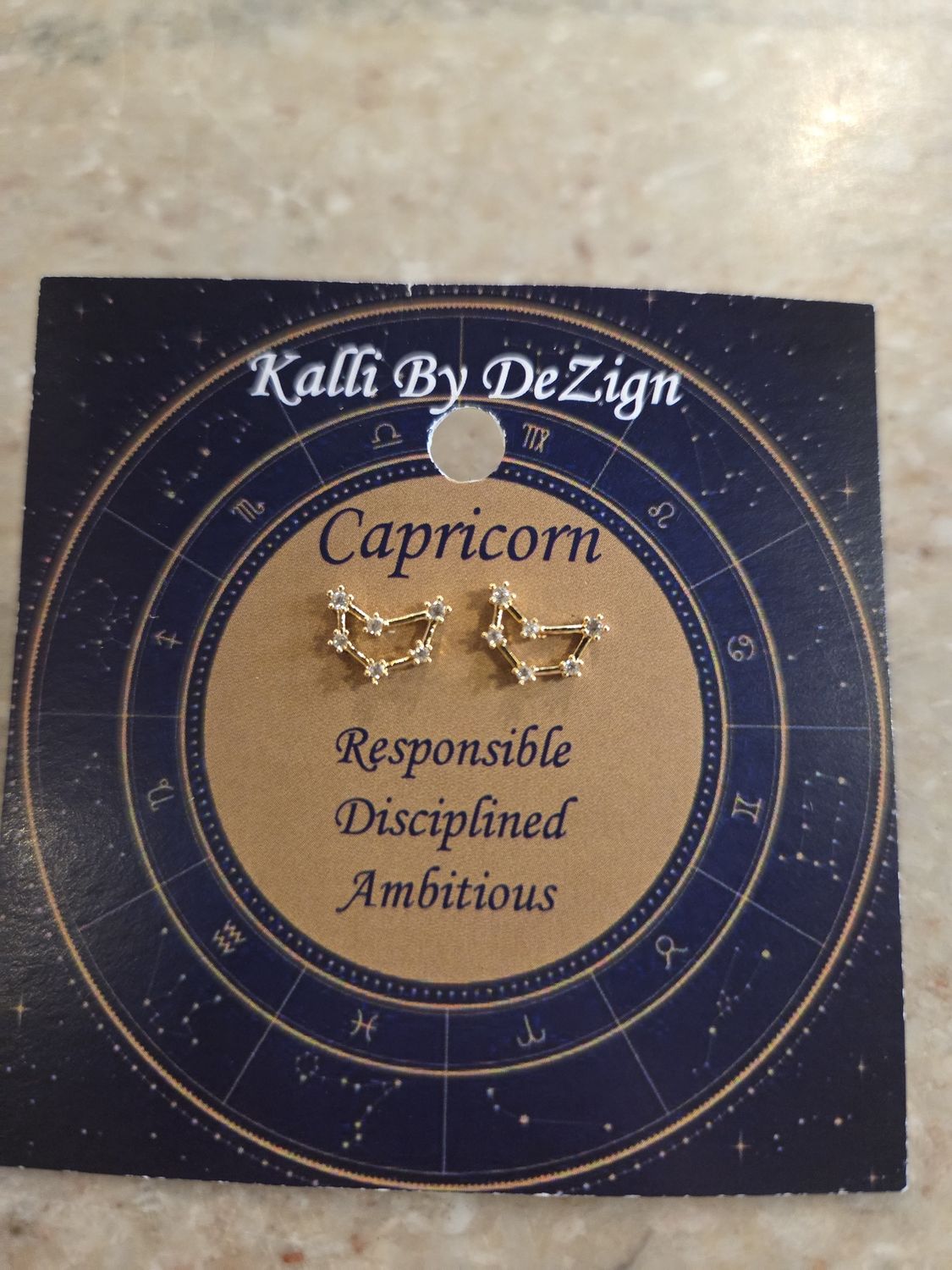 Kalli Earrings Gold Tone Capricorn