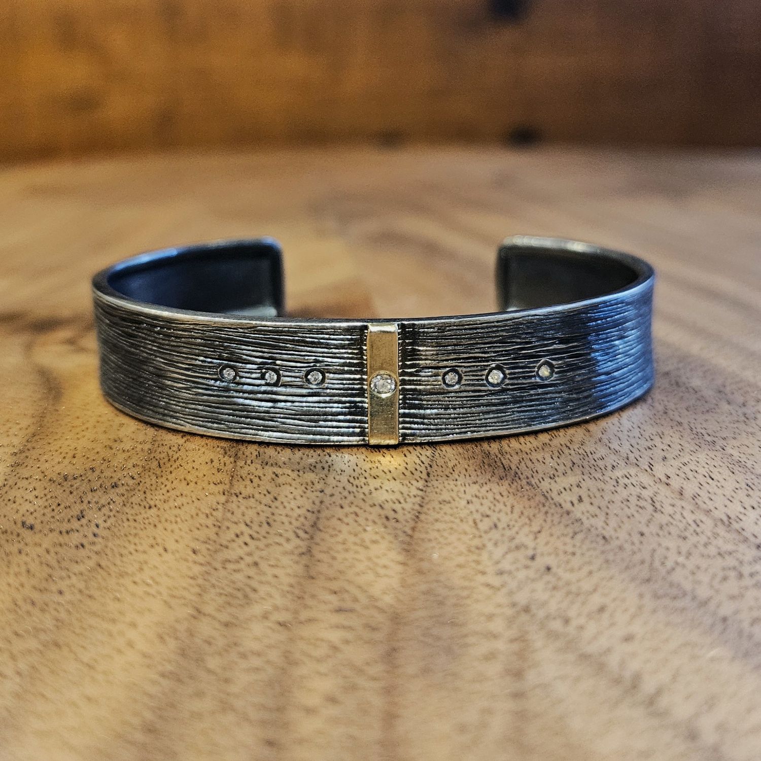 Keleher Cuff Black and Gold Center Stripe 1/2&quot;