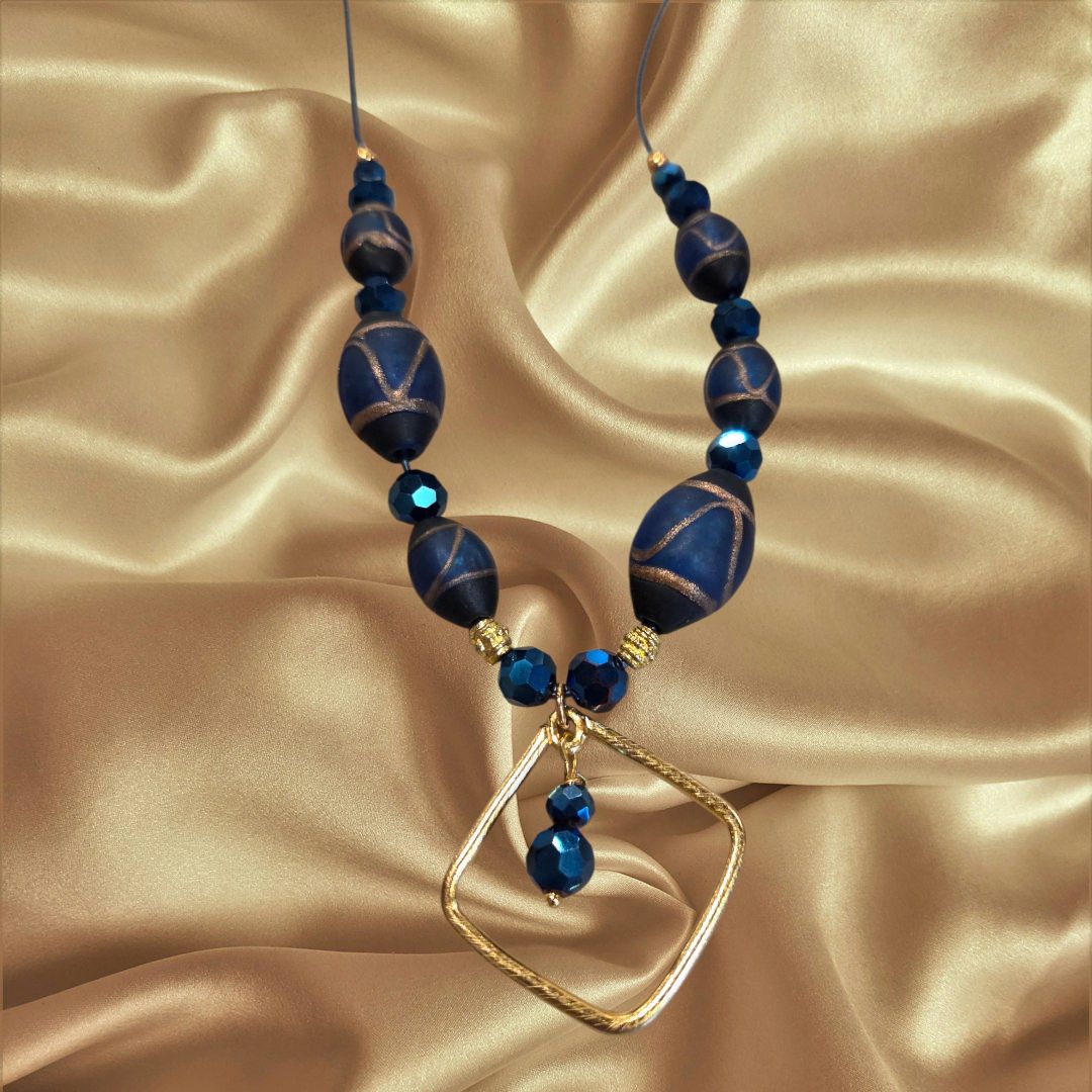 Ciufo Necklace Patterned Blue Beads, Metallic Blue Beads, and Gold Accents