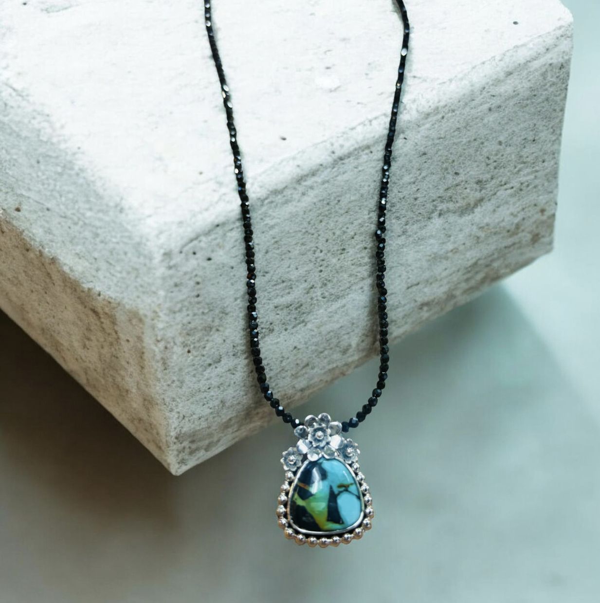 Estancia Necklace Turquoise in Sterling Silver Floral Setting on Black Spinel Chain