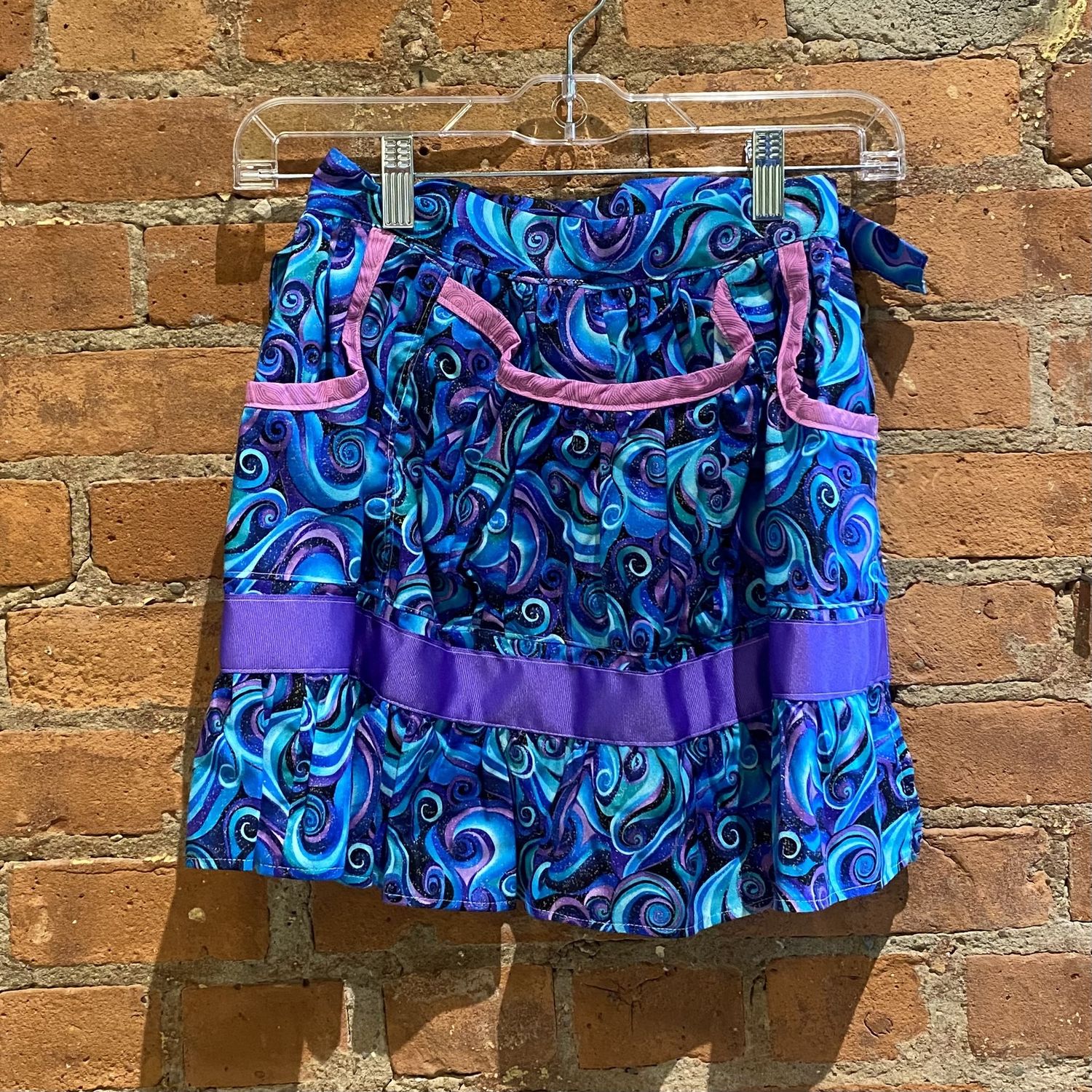 Yvonne Child's Gathering Apron, Color: Purple/Blue Swirl