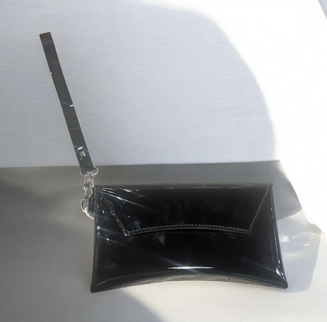 Penrod Leather Curved Clutch Black Patent