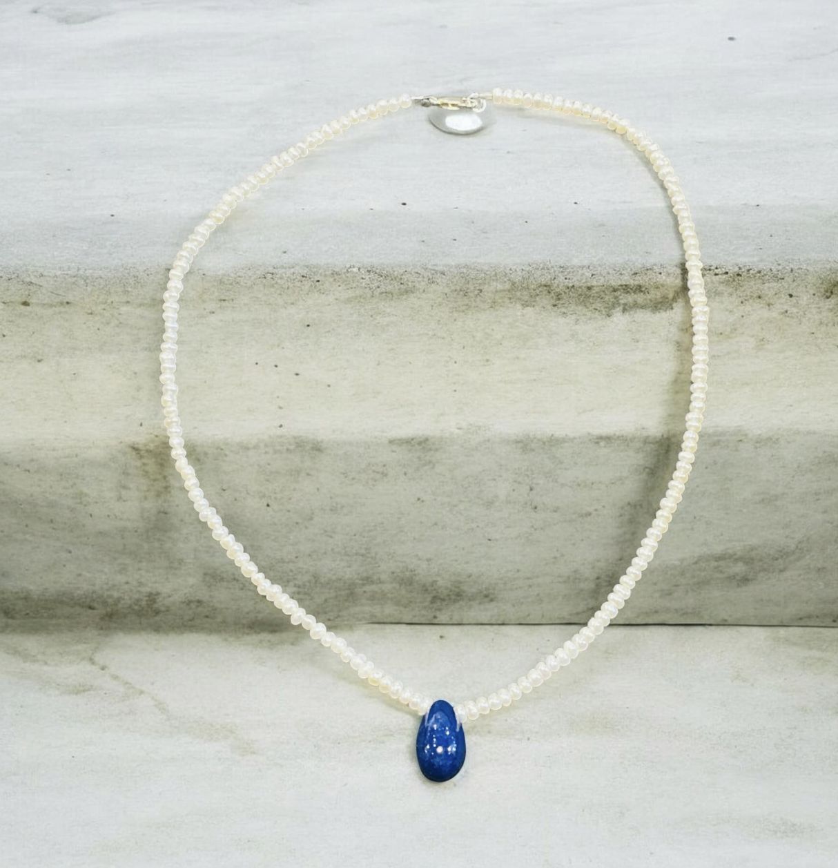 Trueworthy Necklace Tiny Freshwater Pearls and Blue Sapphire Drop