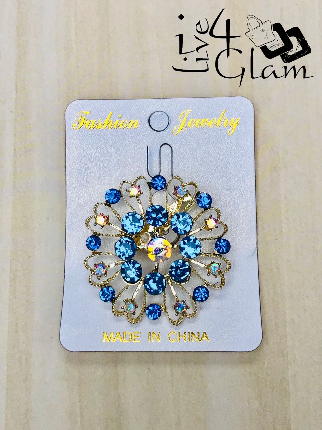 Gold Tone Round Light Blue Rhinestone Broach