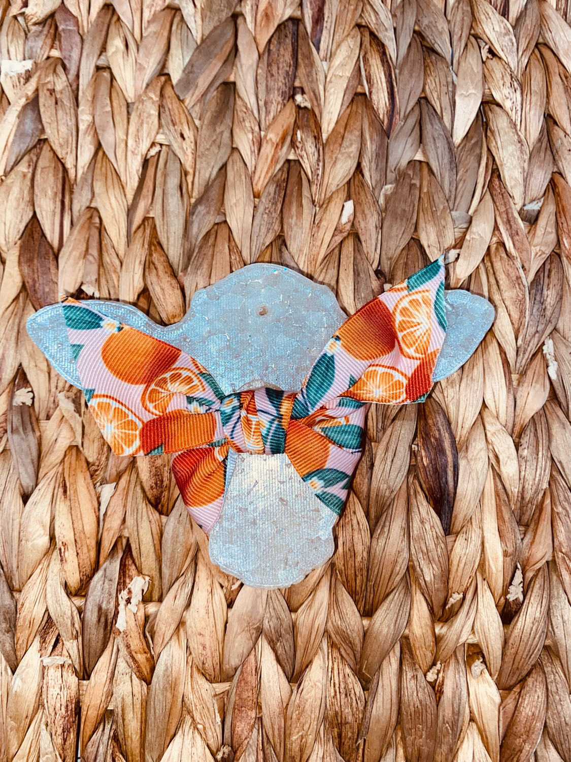 Cow with oranges bow