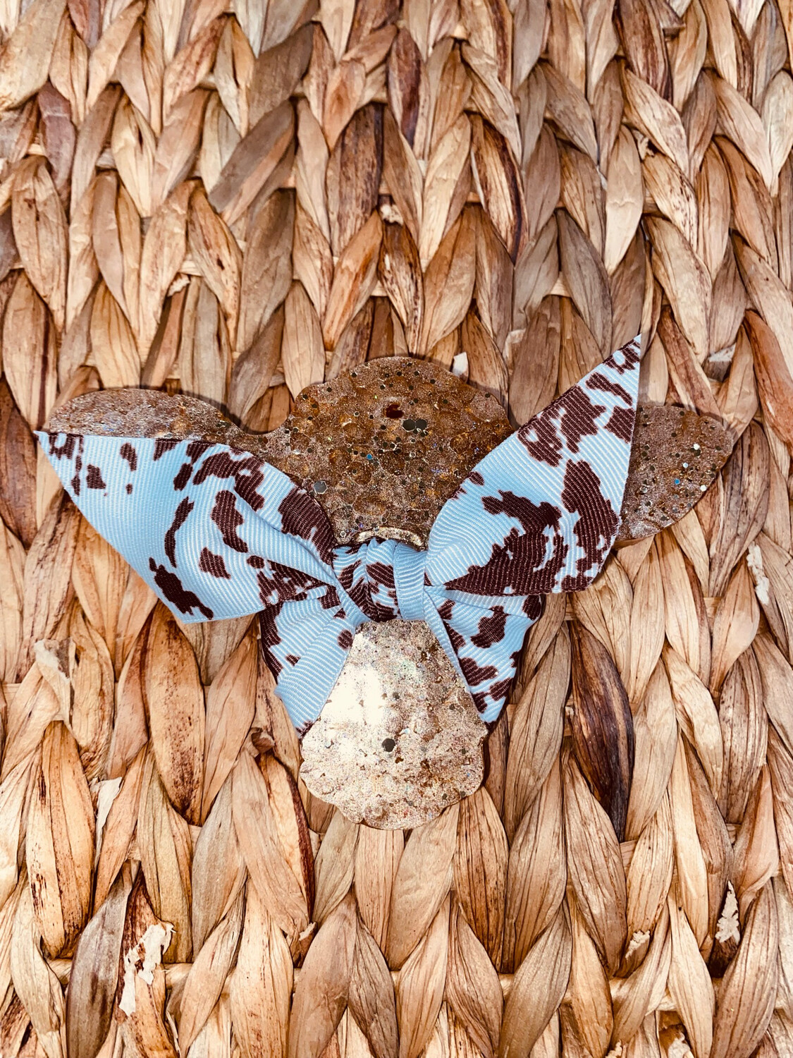 Cow with brown cow print bow