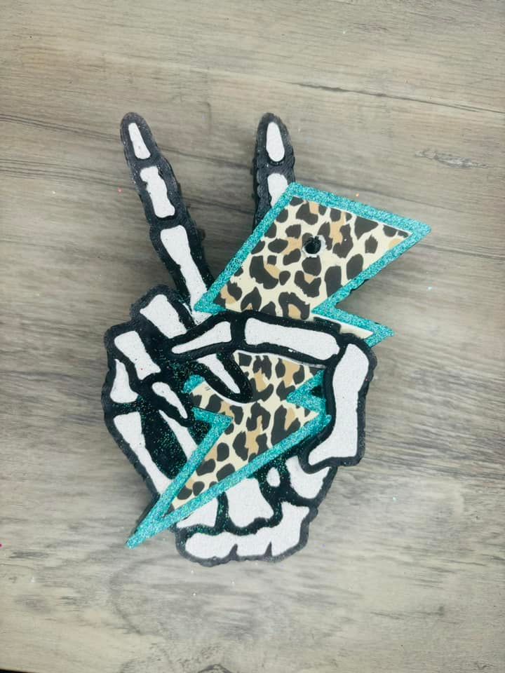 Skeleton hand with cheetah bolt