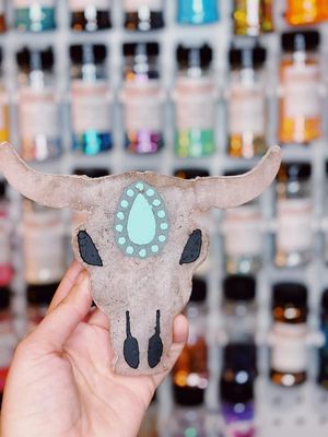 Bull skull with stone