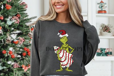 Green guy with tree cake