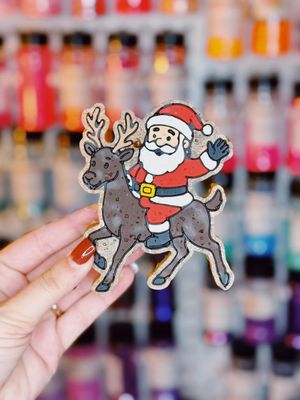 Santa riding reindeer