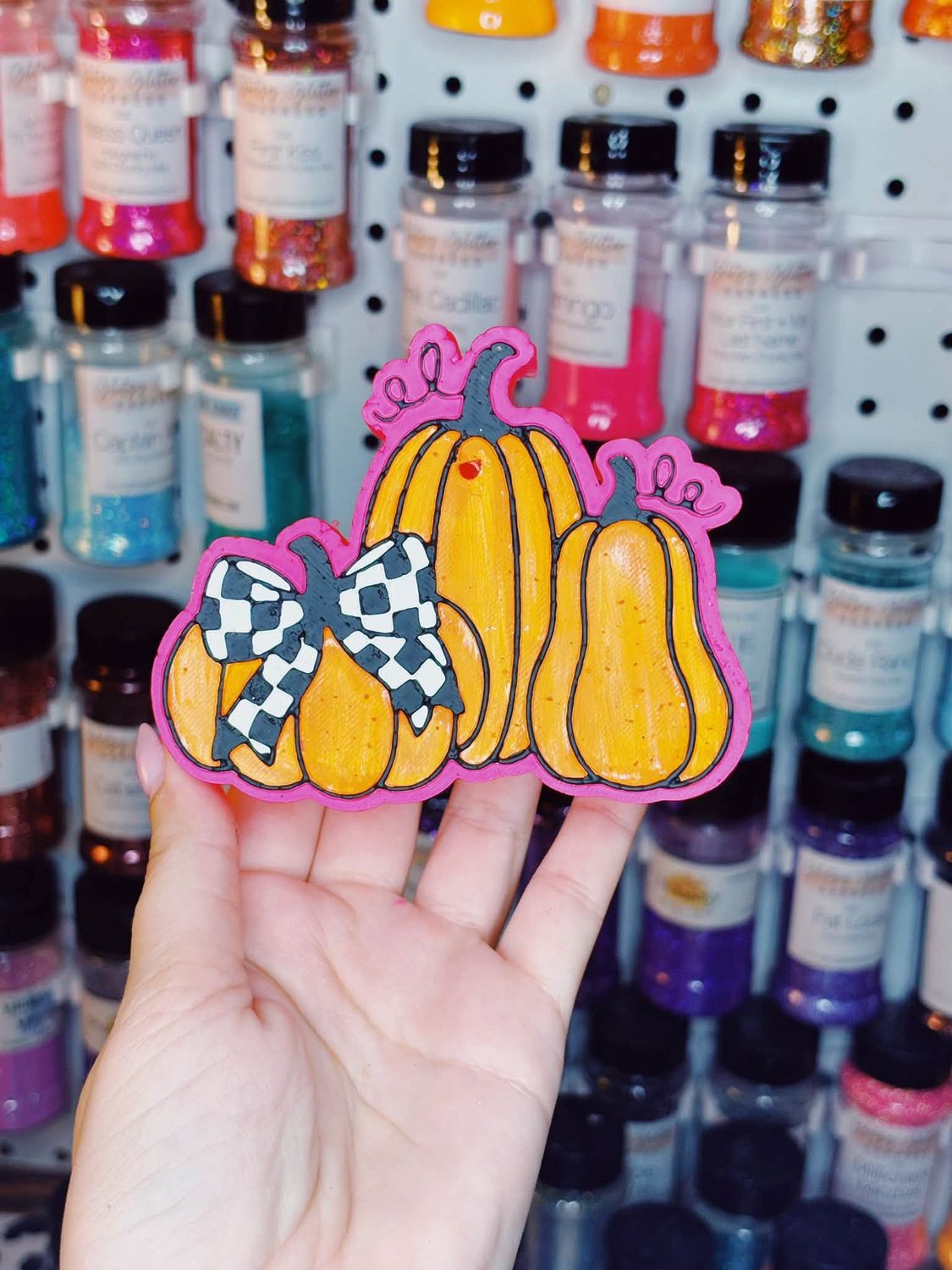 3 pumpkins with checkered bow