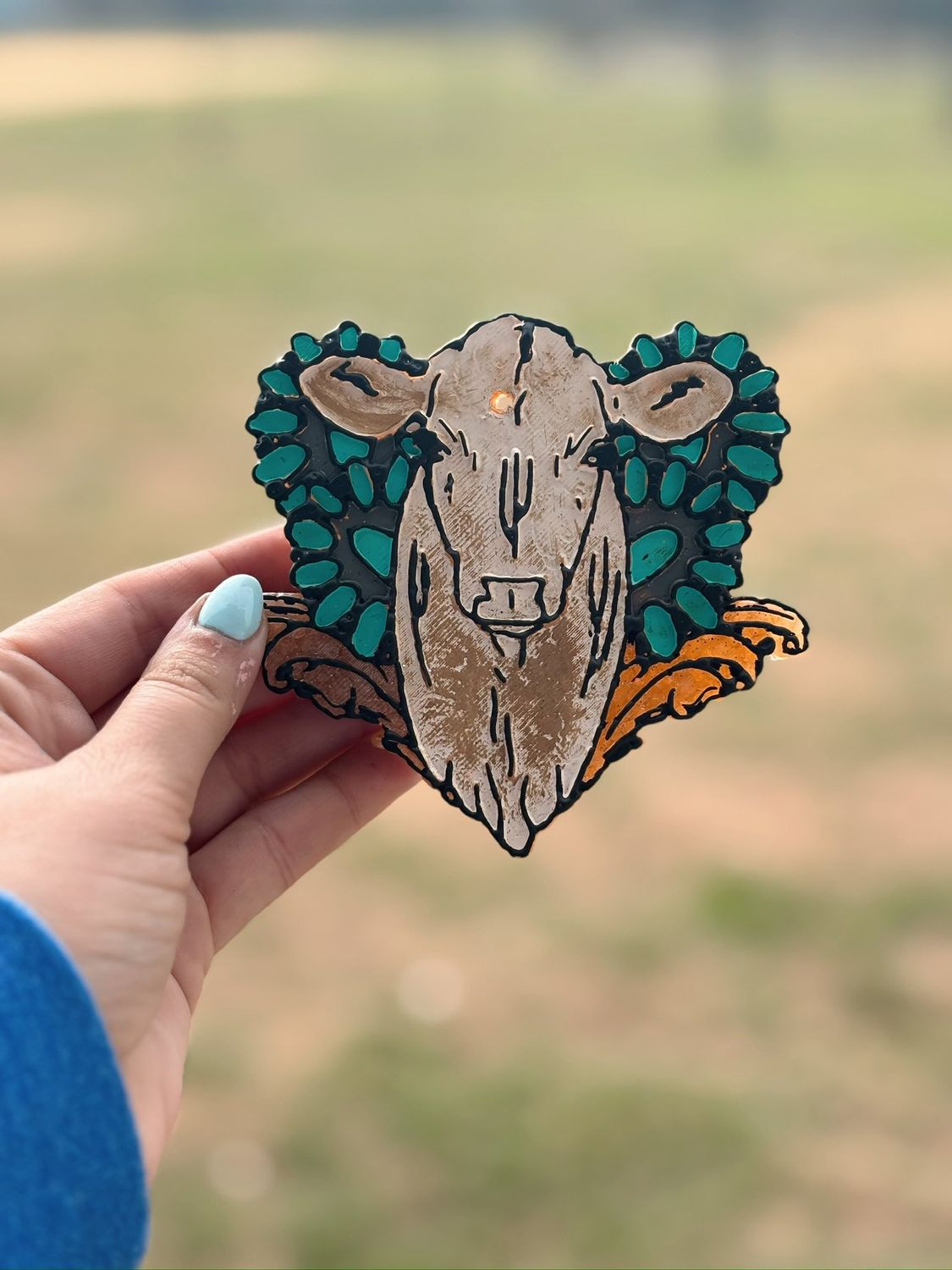 Western cow with stones