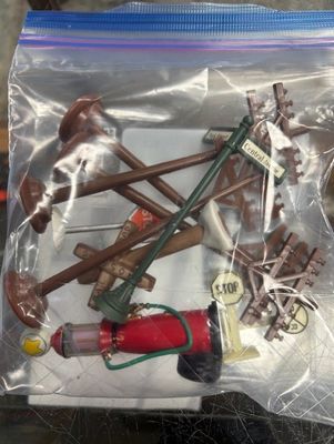 Used O or G plastic accessory pieces for either scale layouts.