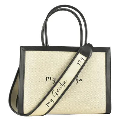my Geisha D'Azure Bag
Shoulder strap included Detachable clutch included Top handle

The bag from the exclusive D'Azure collection is my Geisha's style statement for any season. It combines classic elegance with modern elements. From the desire to innovate and expand the my Geisha product range, we launched the second extension of the fashion collection - D'Azure Bag &amp; Slides Accessories, a collection that marks the continued development of the brand in the fashion area.

The style that defines the D'Azure Bag model is trendy, the front features the my Geisha signature, while the black details enhance the elegant and versatile style of the bag. Featuring a wide, reversible and detachable custom shoulder strap, the D'Azure my Geisha bag can be worn in the hand or on the shoulder, making it easy to integrate into various outfits.

Color: Beige, with details on the barrette and on the front, with the my Geisha monogram
Shoulder strap included
Detachable clutch included
Top handle
1 large compartment
1 pocket on the inside
Model: Classic
Size: 35L x 41H (including handle) x 17W
Protective bag: included
Material: canvas, ecological leather

The bag is cleaned with a soft damp cloth. We recommend that you avoid rough brushes and cleaners that contain alcohol or other harsh cleaning agents. We do not recommend washing with water or in the washing machine. If the bag has accidentally gotten wet, it should be left to dry at room temperature, away from direct contact with heat sources (such as a radiator, fire, hair dryer or direct exposure to the sun).