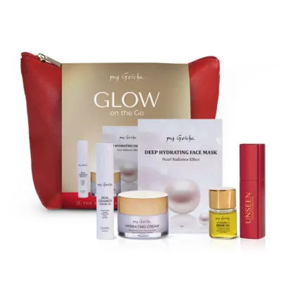 Open my Geisha Glow on the Go Set revealing premium mini skincare products and travel-size perfume, ideal for radiant skin on the go.