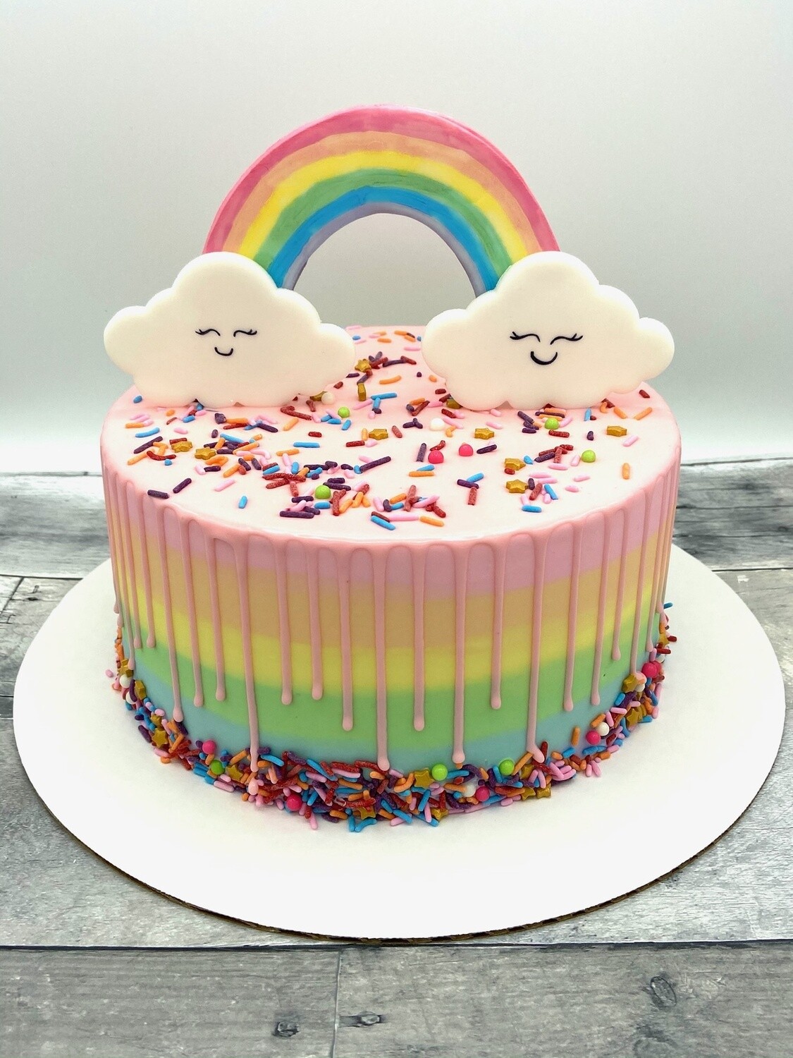 Rainbow Drip Cake with Sprinkles and Rainbow Topper