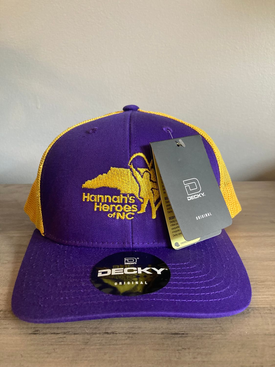 Hannah's Heroes purple and gold hat