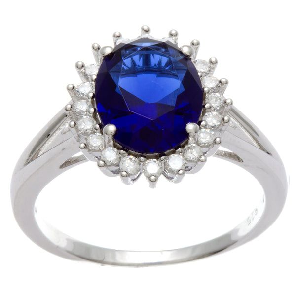 Dazzlers Sterling Silver Rhodium Plated and oval Simulated Sapphire center stone with CZ Halo Ring,…