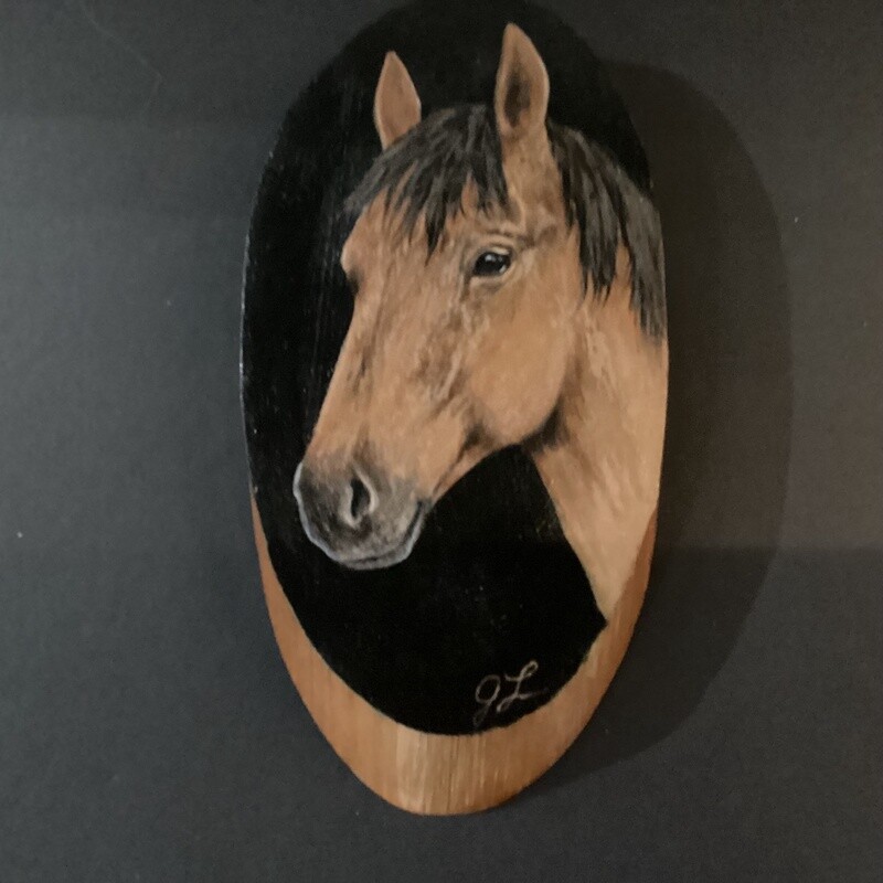 Horse on oval wood board