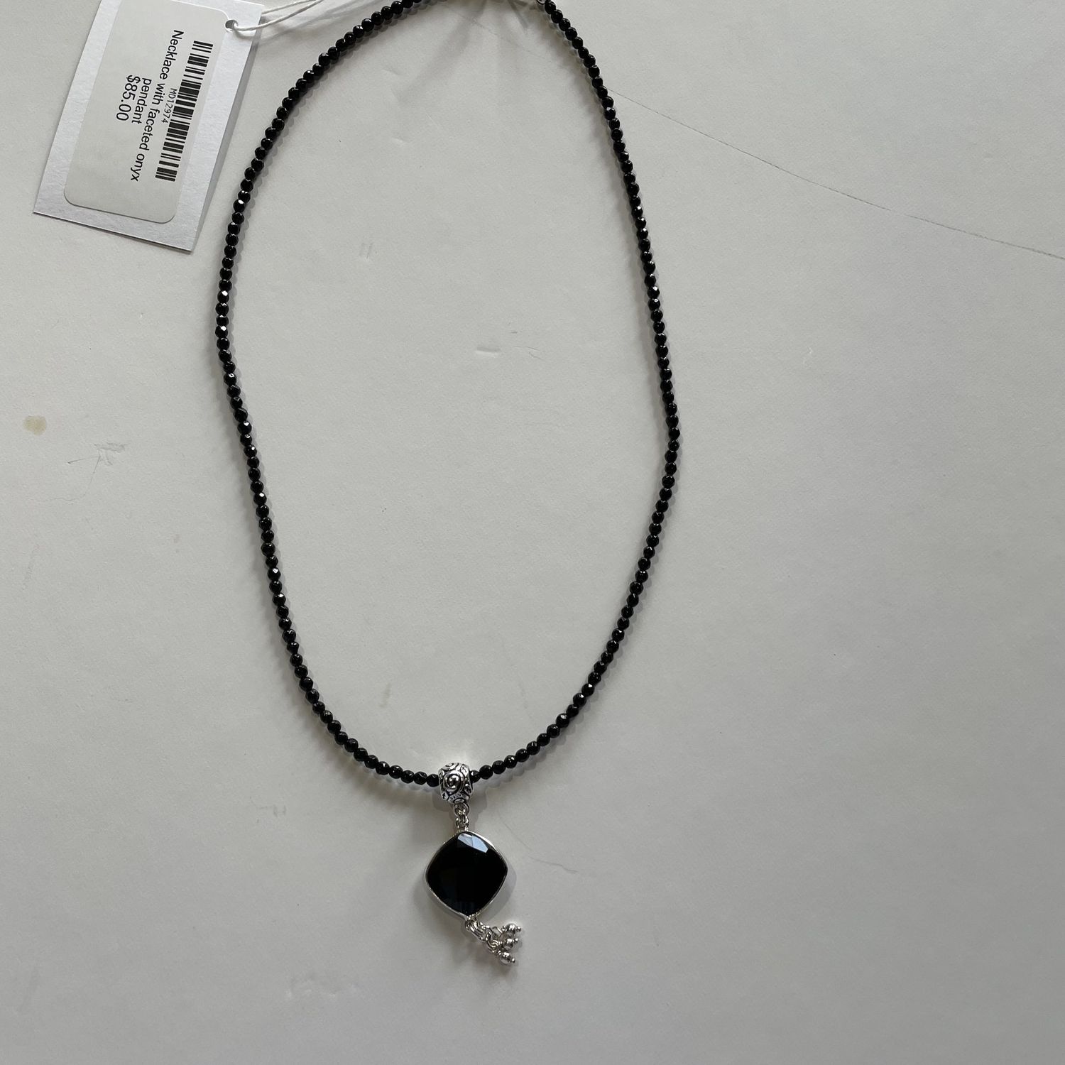 Necklace with faceted onyx pendant
