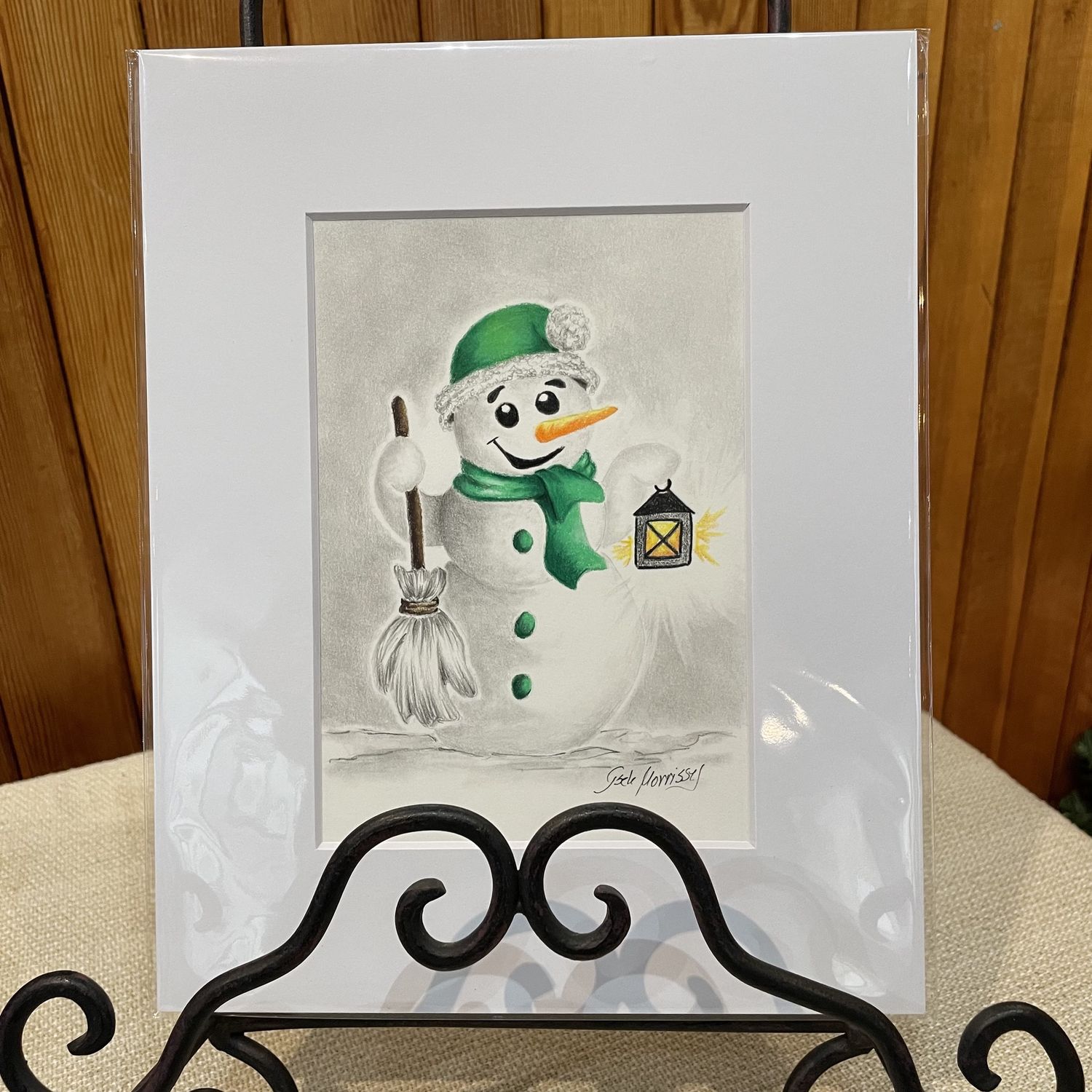 Snowman with green scarf