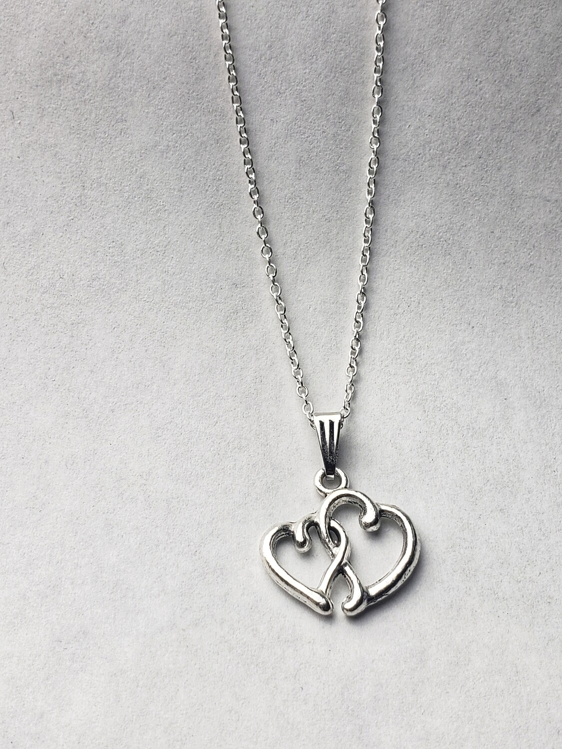 silver necklace with heart pendant