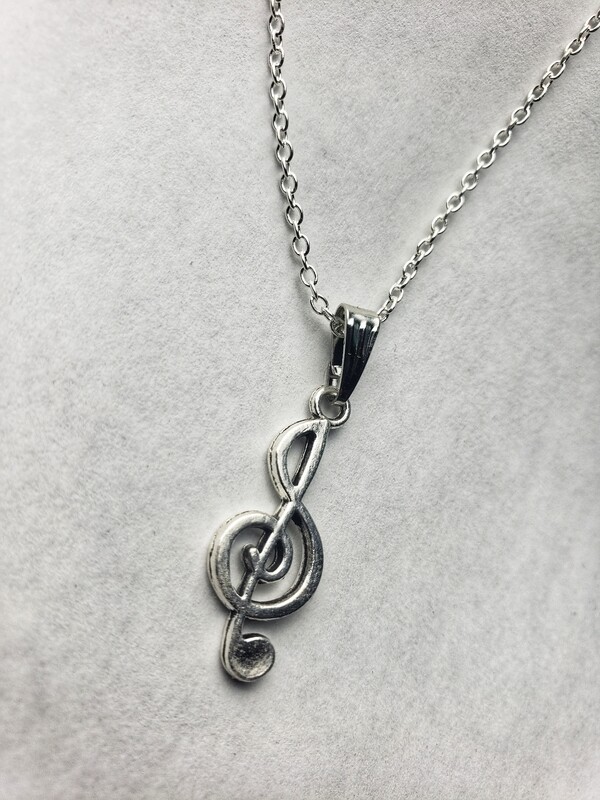 silver necklace with music pendant