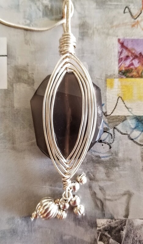 Smokey Quartz Wire Wrapped Pendant. Comes with Sterling Silver 22" Snake Chain and Black Adjustable Cord chain.
