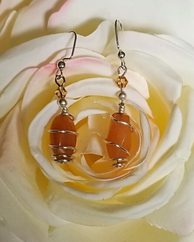 Carnelian Gemstone Wire Wrapped in Silver with Swarovski Crystal.
All purchases come with gift bag.