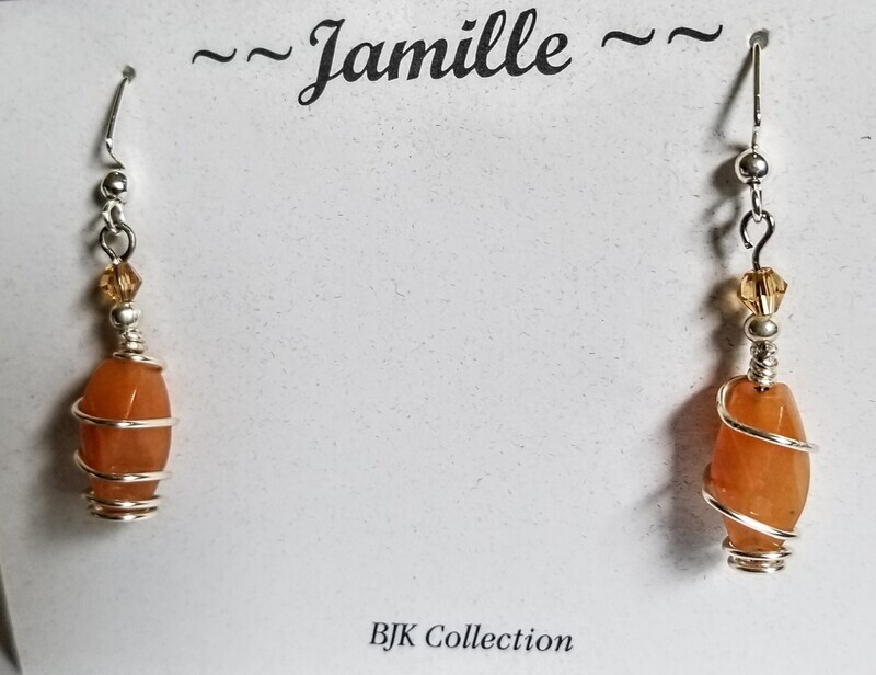 Carnelian Gemstone Wire Wrapped in Silver with Swarovski Crystal.
All purchases come with gift bag.