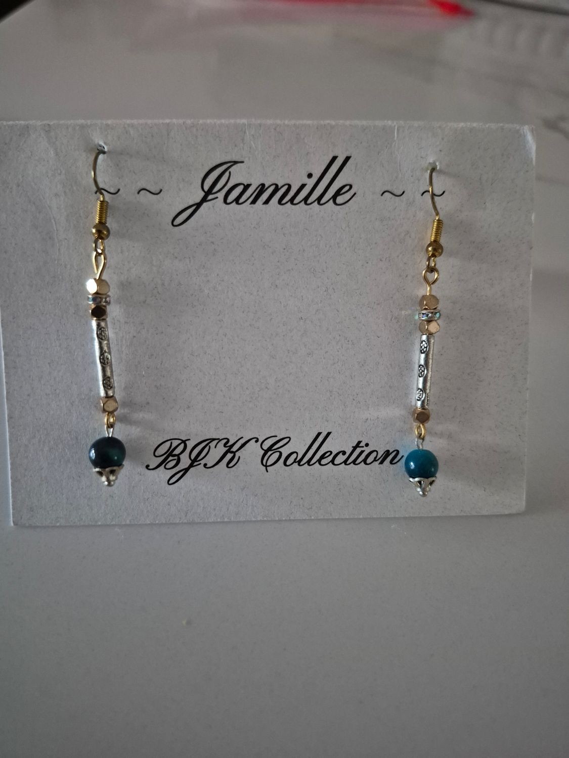 Silver with gold, Lapis Lazuli bead, dangle earrings.