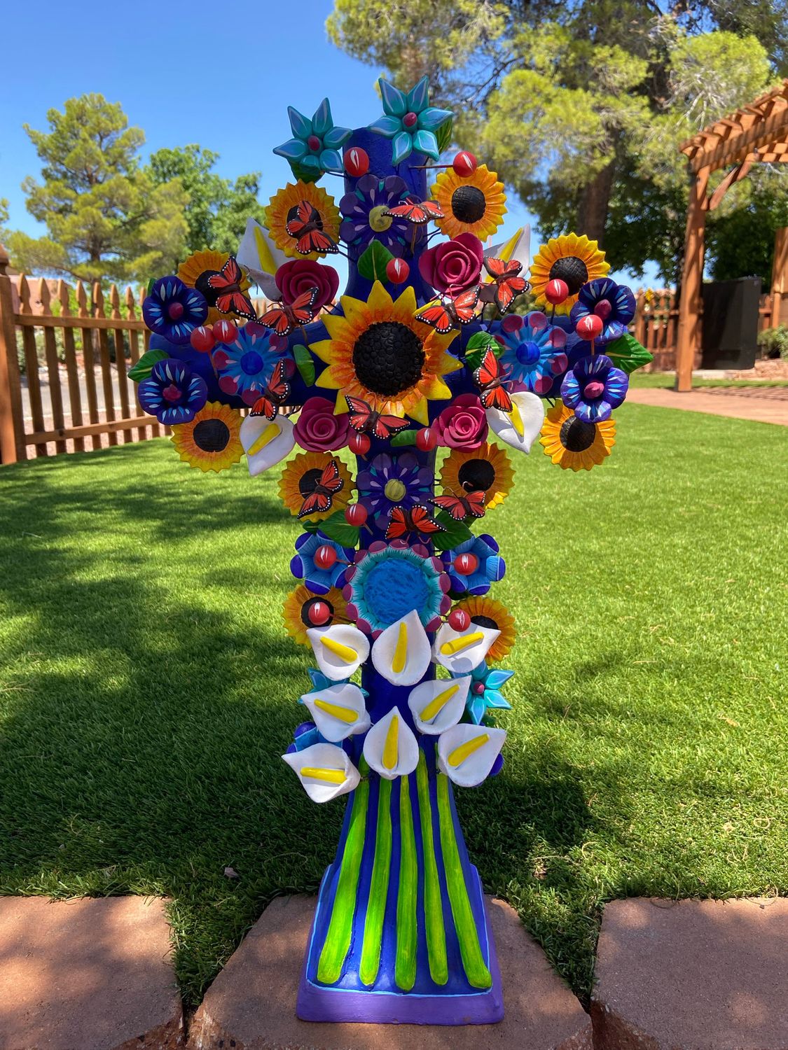 Blue Cross Stand With Flowers