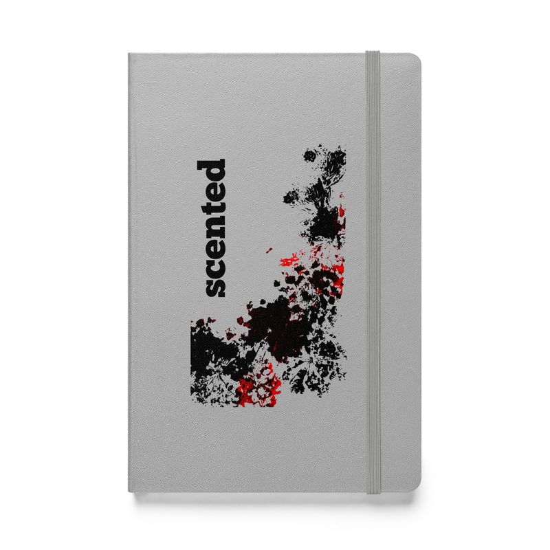 Scented - Artist designed Hard cover notebook front view. Silver color with black and red design print.