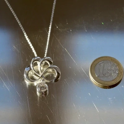 Sassi Design, Riemu riipus