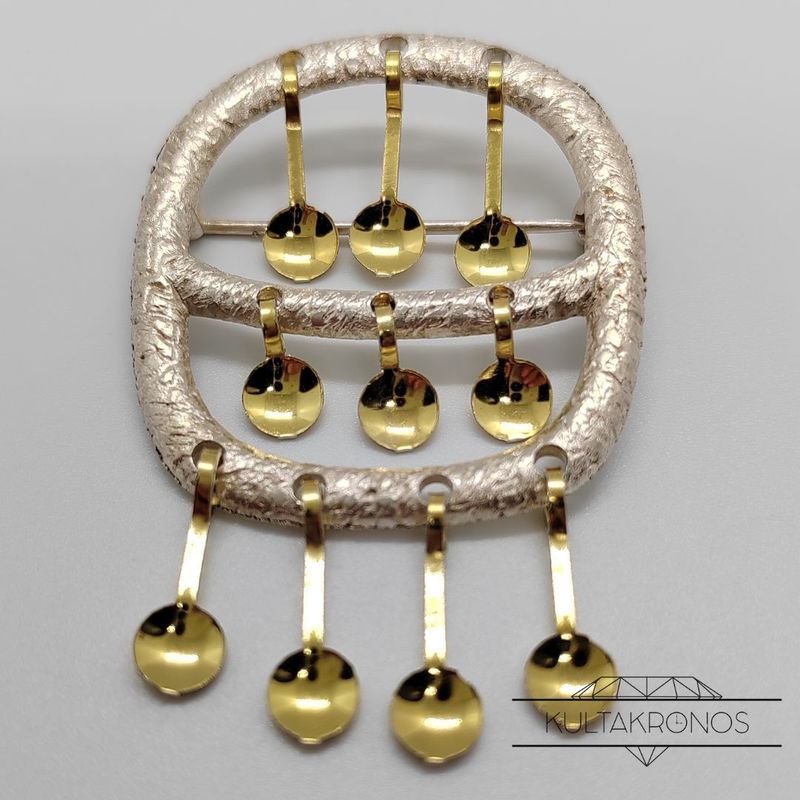 Hopeinen rintakoru - 1969