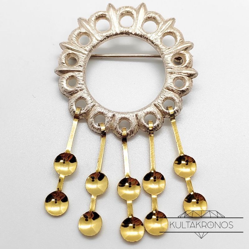 Hopeinen rintakoru - 1969