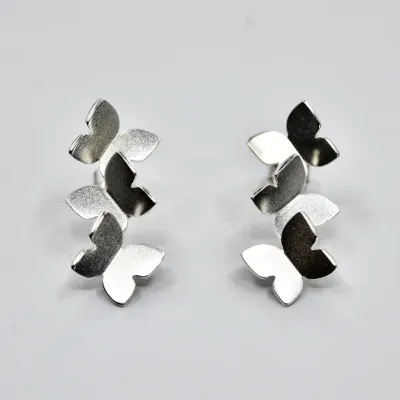 Sassi Design, Heijastuksia korvakorut perhonen