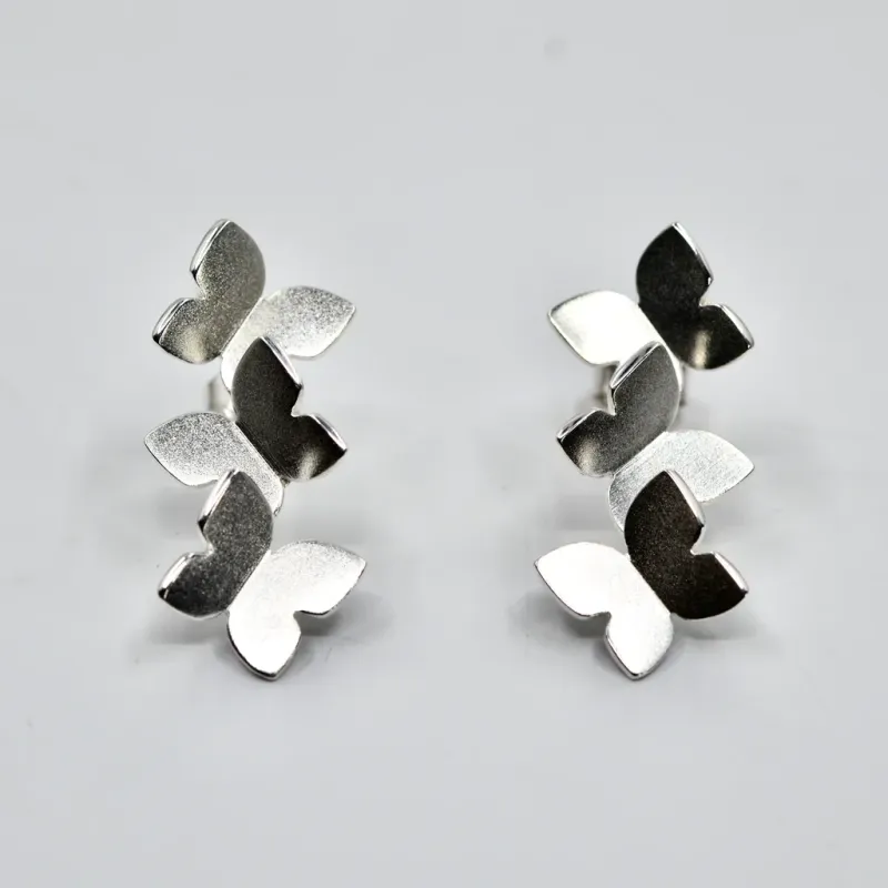 Sassi Design, Heijastuksia korvakorut perhonen