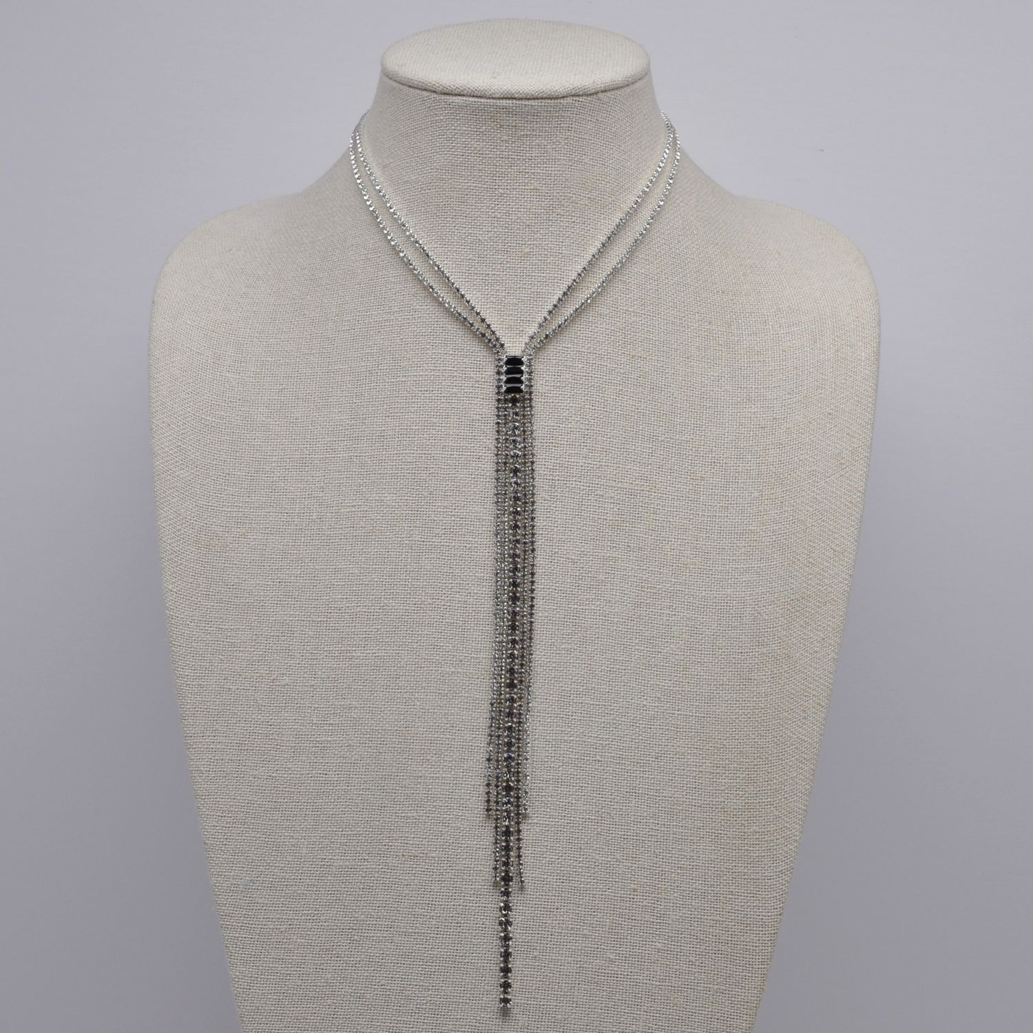 J18291N2S1 CZ/JET/CLR/S BAGUET STN TASSL NECK