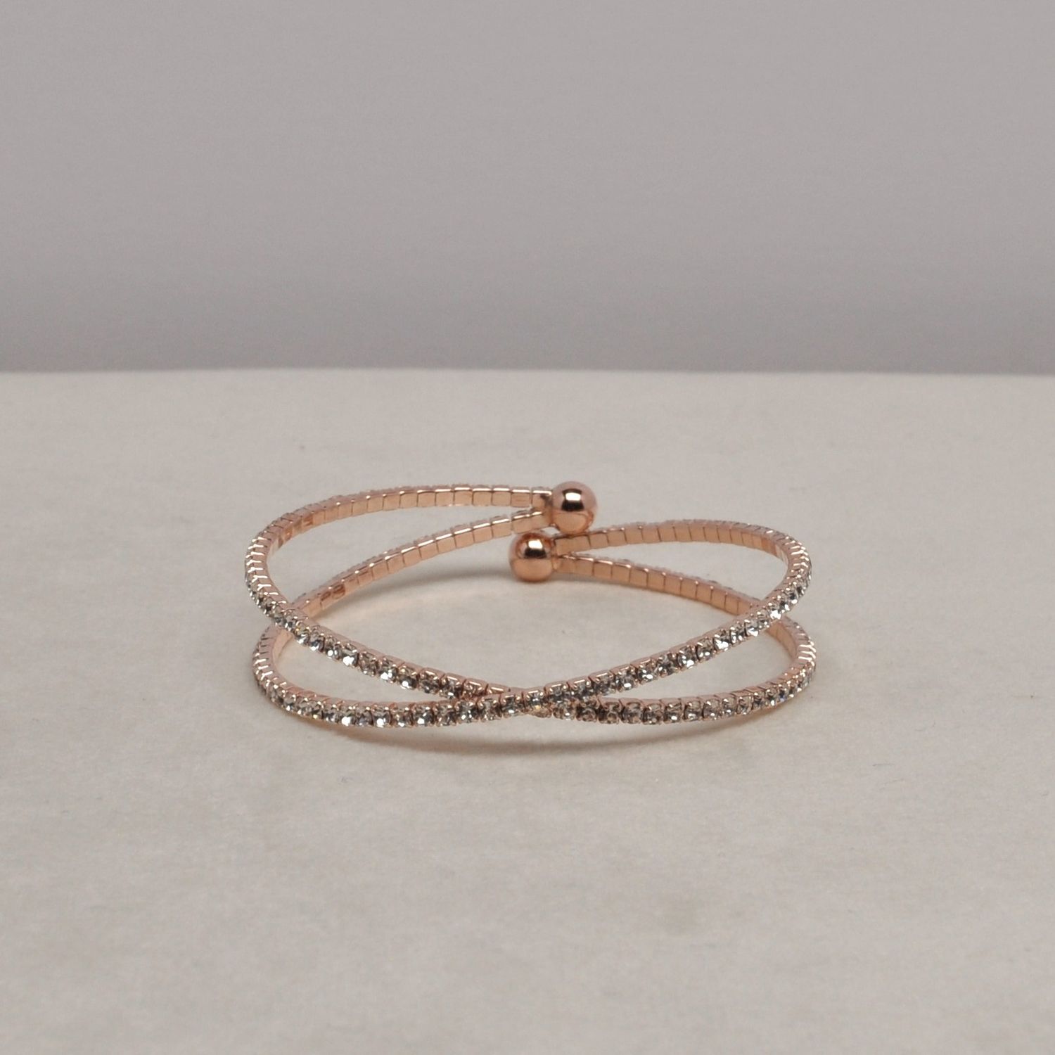 J83361B1RG CLR/RG X SHAPED CUFF BRC