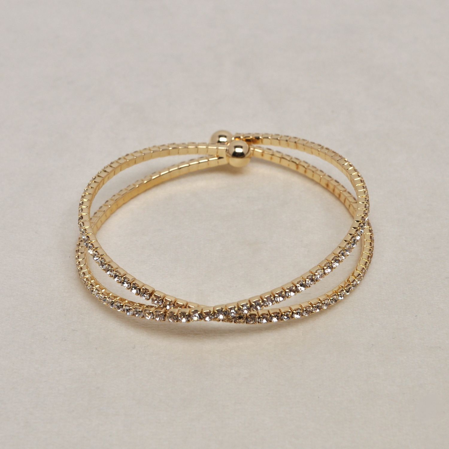 J83361B1G CLR/G X SHAPED CUFF BRC