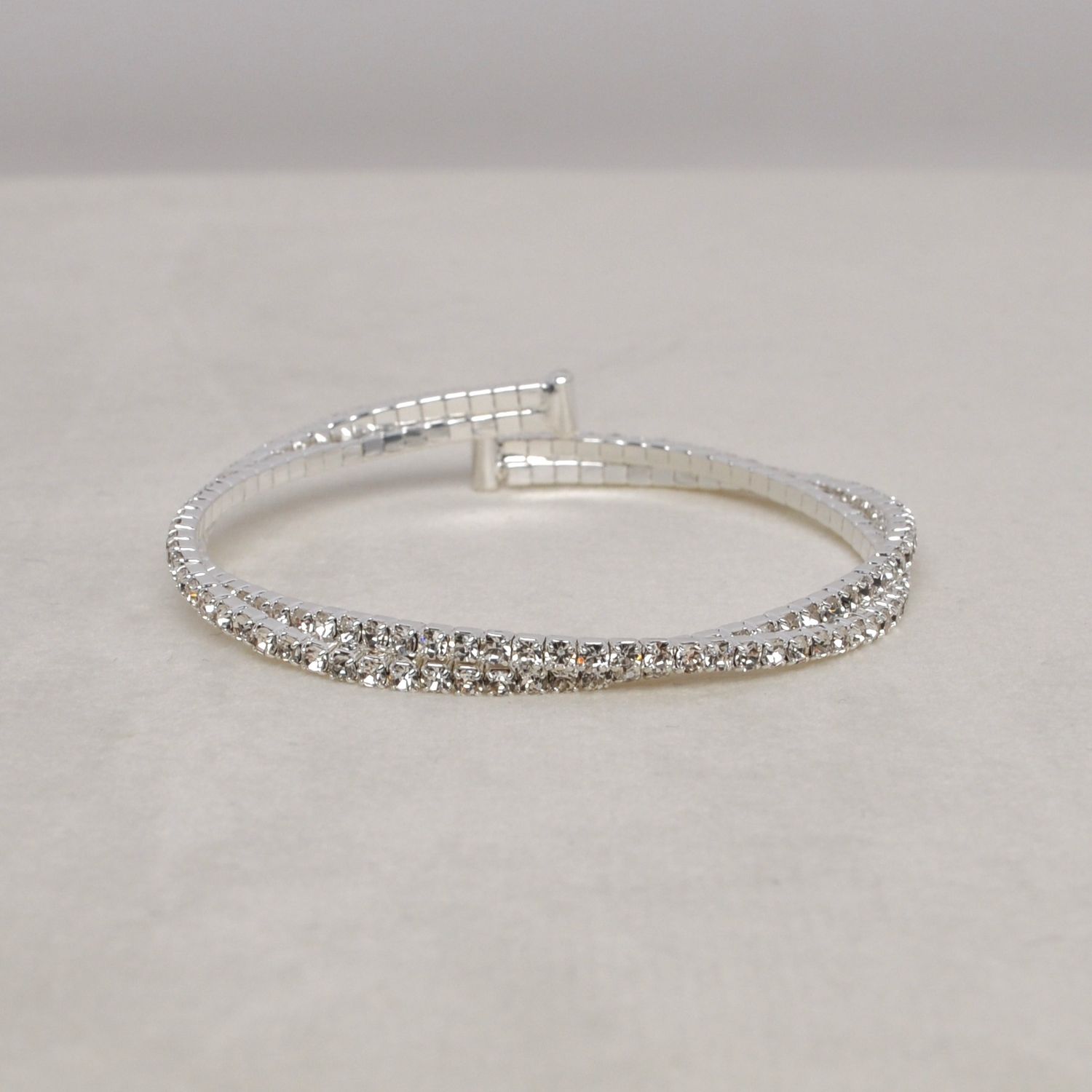 J83487B1S CLR/S  2 LINE TWSTD CUFF BRAC